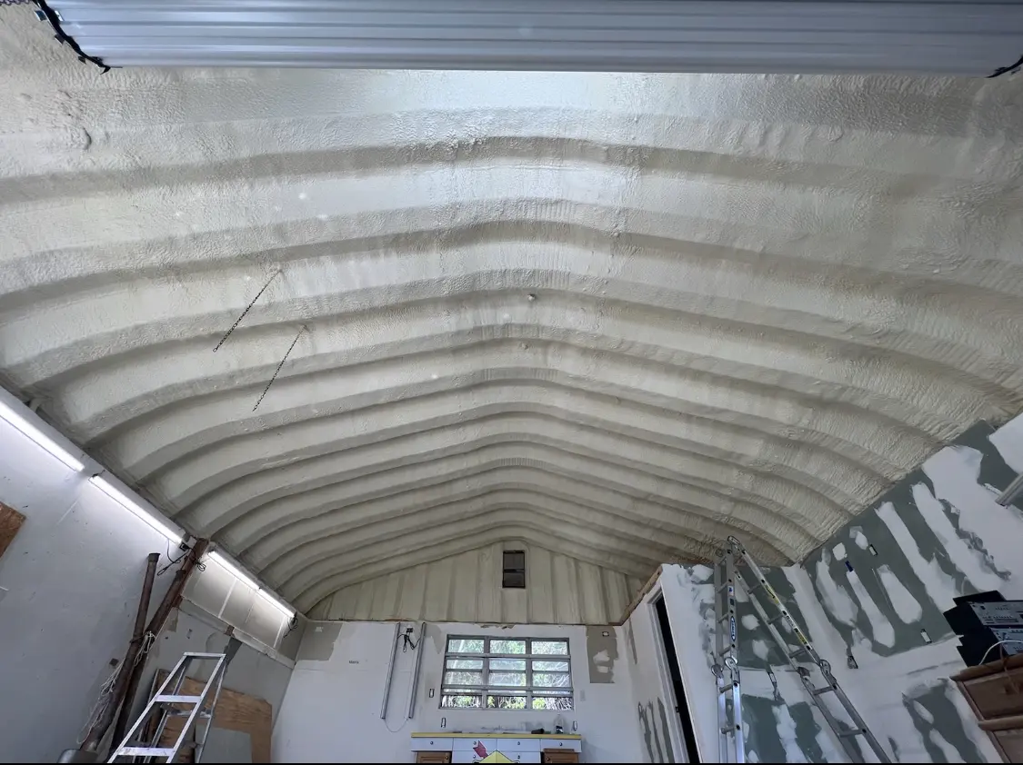 Spray polyurethane foam applied to the underside of a metal roof deck in North Star
